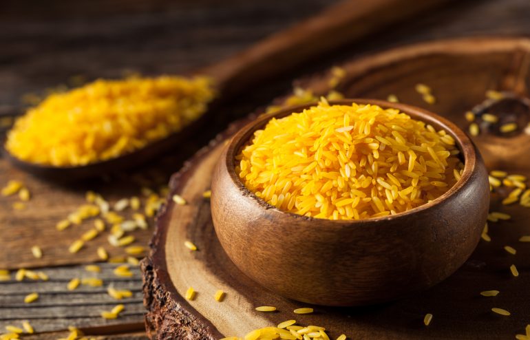 Raw Organic Yellow Saffron Rice in a Bowl